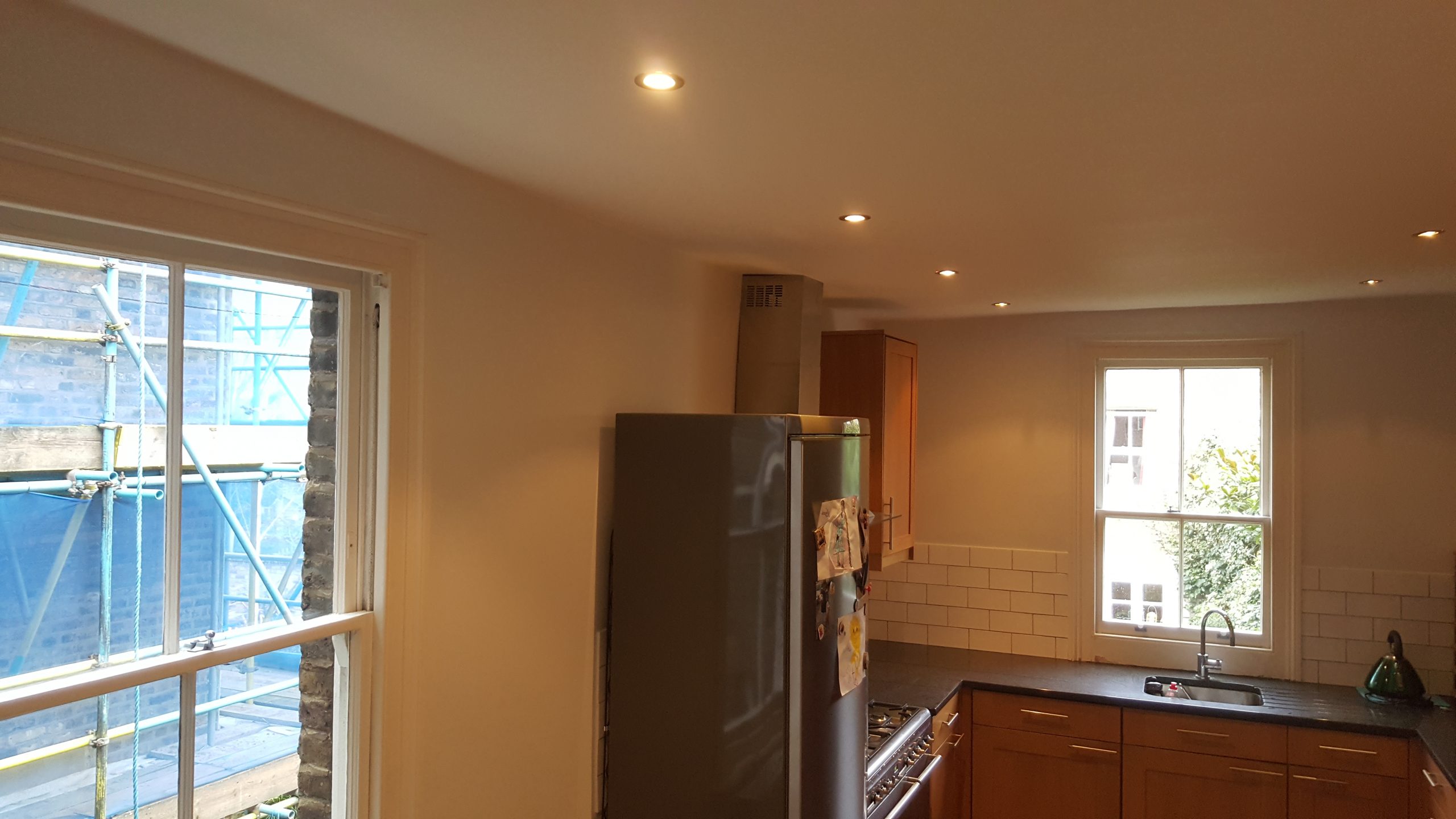 finished wall after strip down affected area, apply damp treatment, apply filler, sanding, redecorate